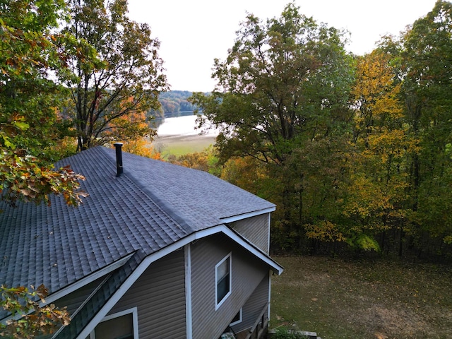 view of side of home featuring a water view