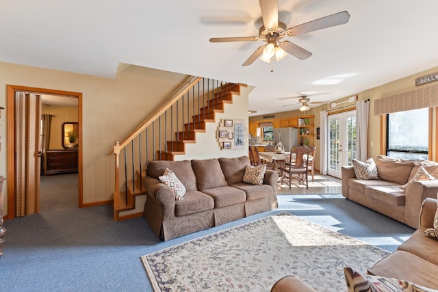 living room with light colored carpet, ceiling fan, and french doors