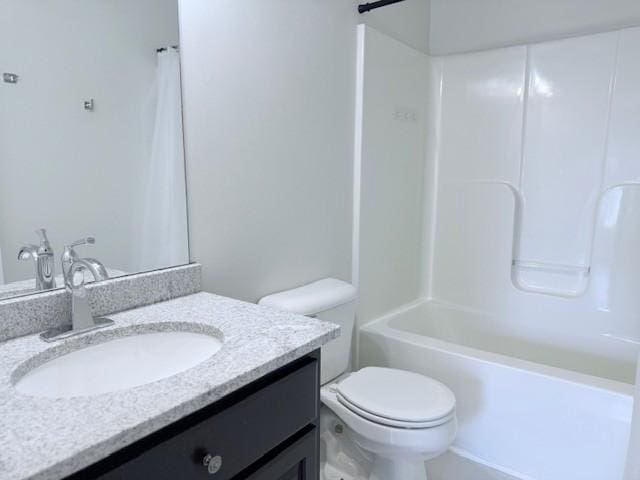 full bathroom with shower / tub combination, vanity, and toilet