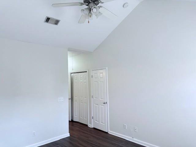 unfurnished room with high vaulted ceiling, dark hardwood / wood-style floors, and ceiling fan