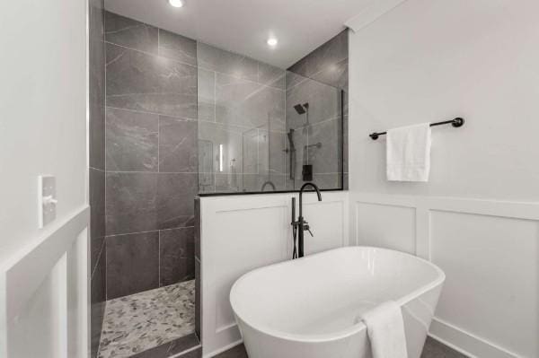 bathroom with shower with separate bathtub