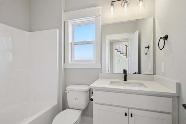 full bathroom with vanity, toilet, and washtub / shower combination