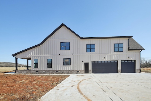 modern inspired farmhouse featuring a garage