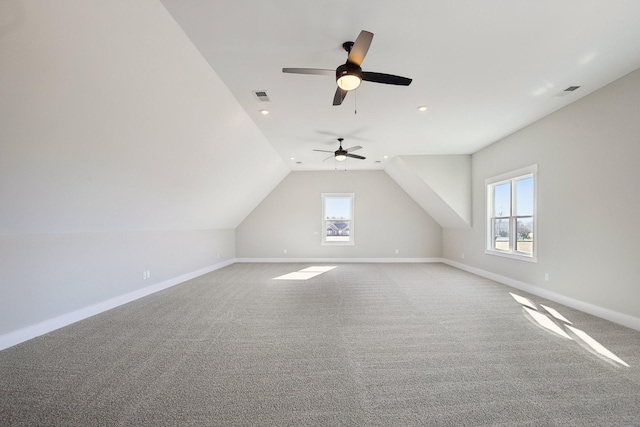 bonus room featuring lofted ceiling and carpet flooring