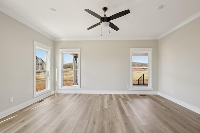 unfurnished room featuring ornamental molding, light hardwood / wood-style floors, and ceiling fan