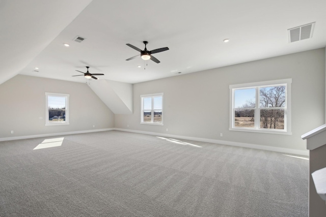 bonus room with ceiling fan, lofted ceiling, and carpet flooring