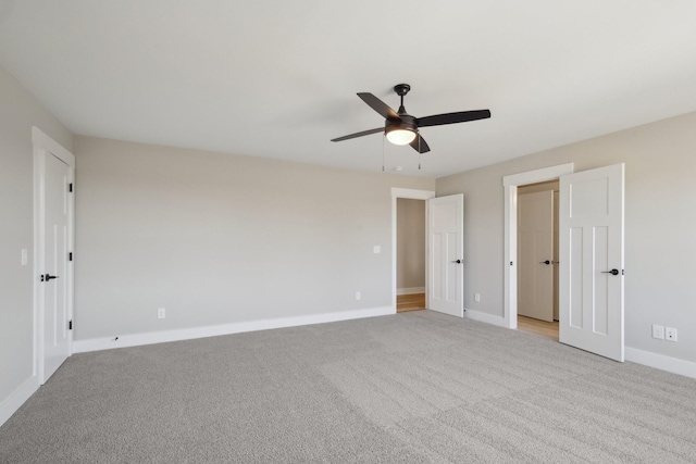 unfurnished bedroom featuring ceiling fan and light colored carpet