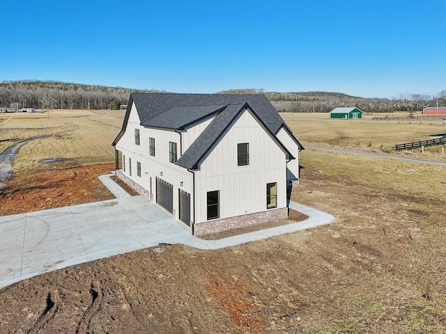 exterior space with a rural view