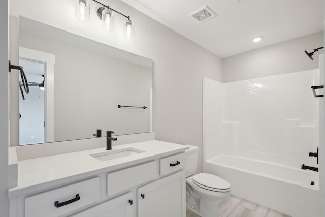 full bathroom with vanity, bathtub / shower combination, and toilet