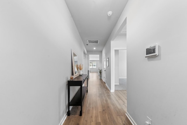 hallway featuring hardwood / wood-style flooring