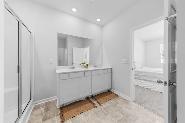 bathroom with vanity and an enclosed shower