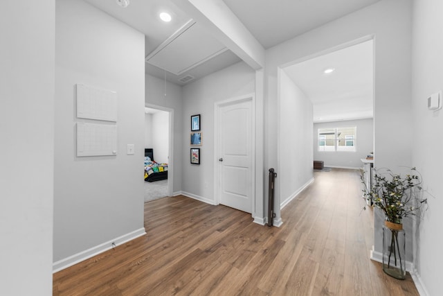 corridor featuring wood-type flooring