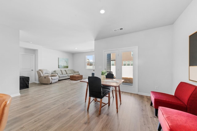 dining room with light hardwood / wood-style floors