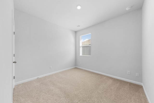 empty room with carpet flooring