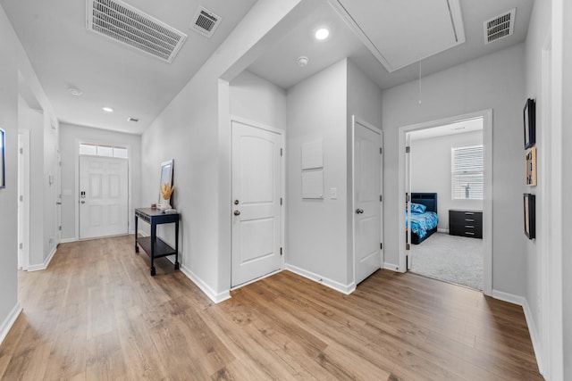 hallway with light wood-type flooring