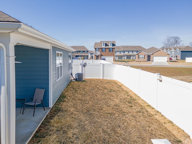 view of yard with central AC unit