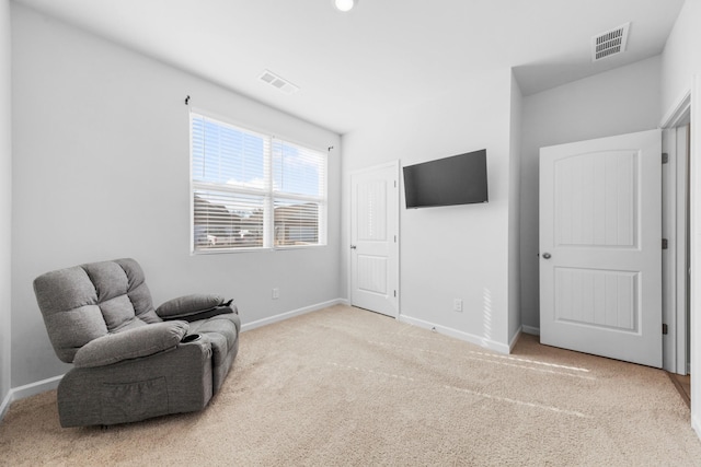 sitting room featuring carpet flooring