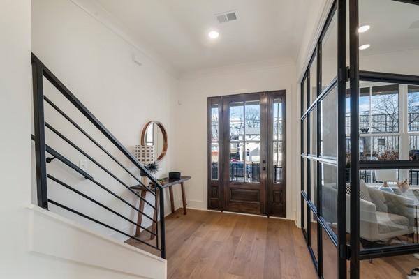 entryway with hardwood / wood-style flooring