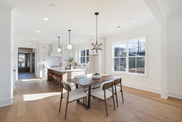 dining room with light hardwood / wood-style floors