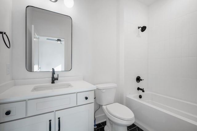 full bathroom with vanity, tiled shower / bath, and toilet