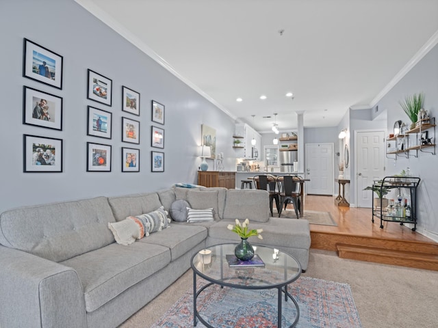 living room featuring ornate columns and ornamental molding