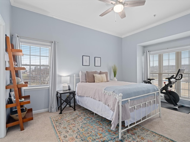 bedroom featuring crown molding, ceiling fan, and carpet