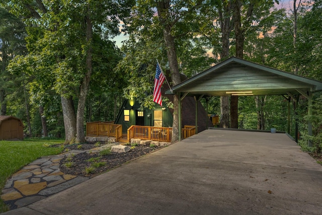 view of community with a wooden deck and a storage unit