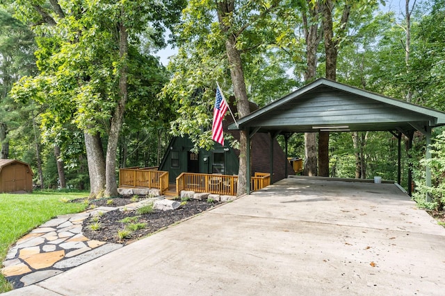 exterior space featuring a storage shed and a wooden deck