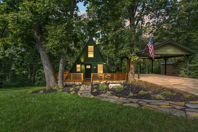 view of front of property with a front yard and a deck