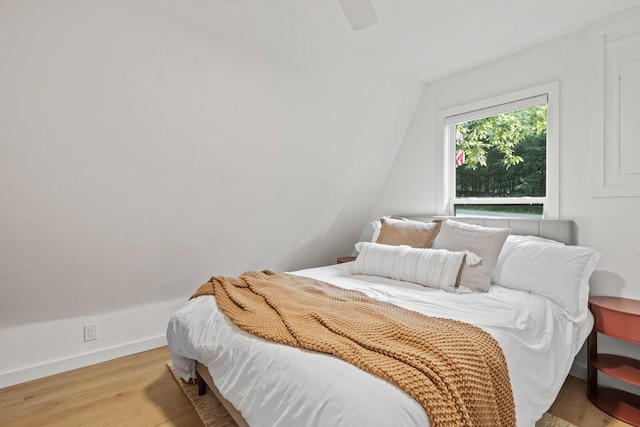 bedroom with ceiling fan and light hardwood / wood-style flooring