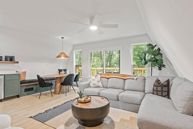 living room featuring ceiling fan and light hardwood / wood-style flooring