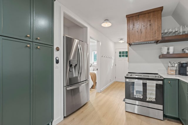 kitchen with stainless steel appliances, green cabinetry, and light wood-type flooring