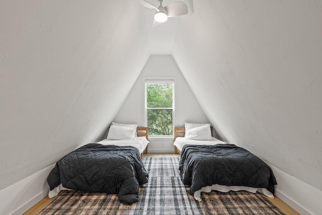 bedroom with ceiling fan and vaulted ceiling