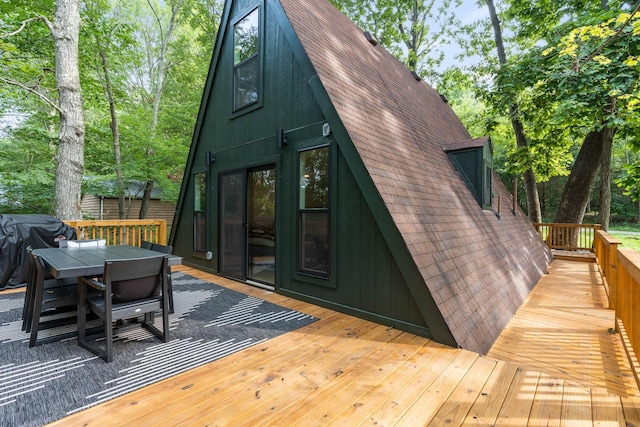 wooden terrace featuring grilling area