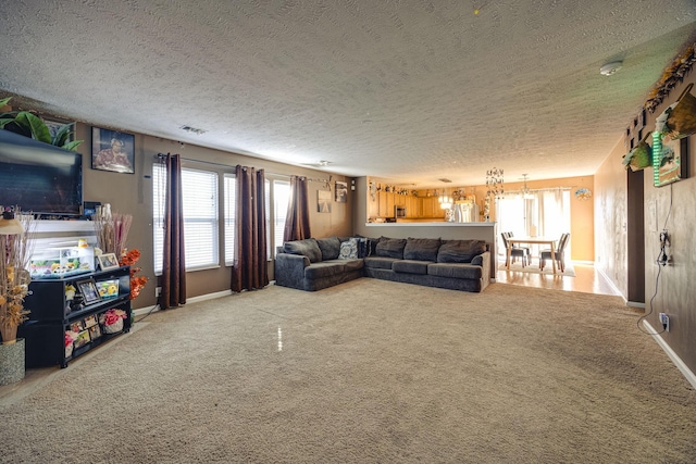 living room with carpet and a textured ceiling