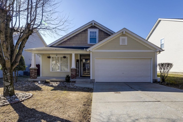 view of front of house featuring a porch and a garage