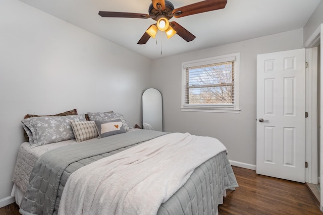 bedroom featuring dark wood-type flooring and ceiling fan