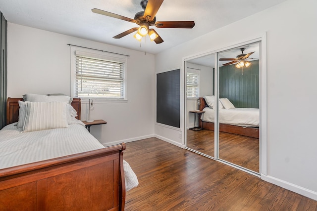 bedroom with ceiling fan, dark hardwood / wood-style floors, and a closet