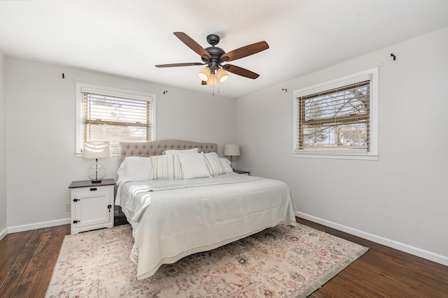 bedroom featuring ceiling fan and dark hardwood / wood-style floors