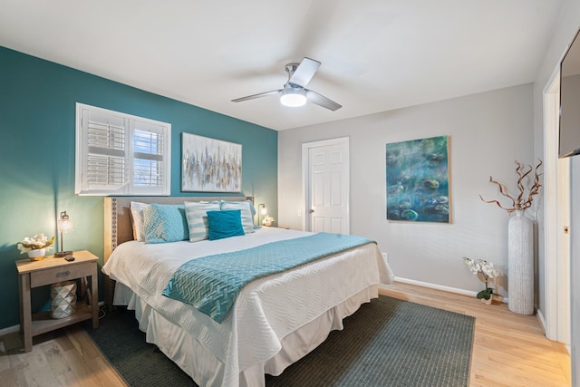 bedroom featuring ceiling fan and light wood-type flooring