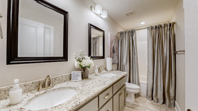 full bathroom with vanity, toilet, tile patterned flooring, and shower / tub combo