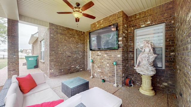 view of patio / terrace featuring ceiling fan and an outdoor living space