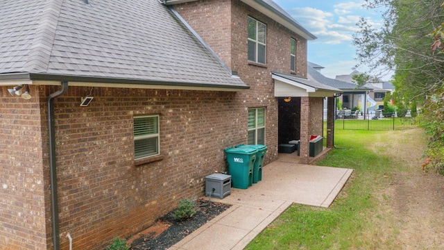 exterior space featuring a patio area and a lawn