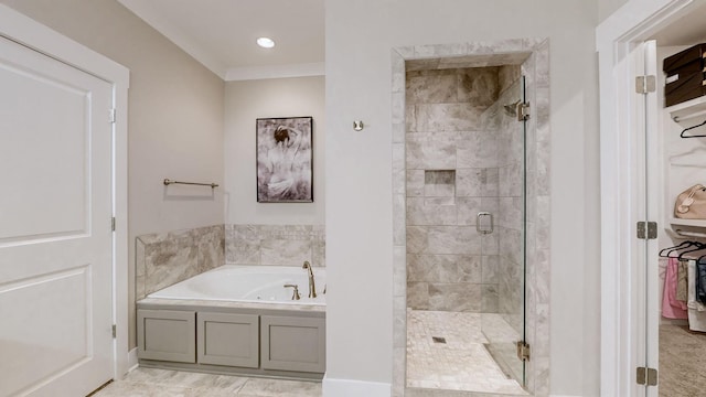 bathroom featuring shower with separate bathtub