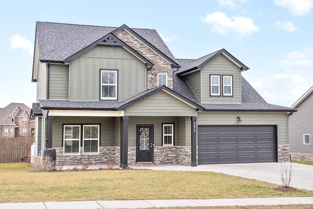 craftsman-style house featuring a garage, a front lawn, and a porch