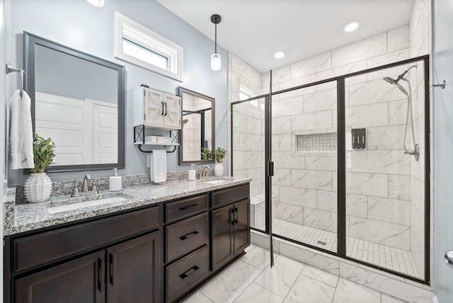 bathroom with an enclosed shower and vanity