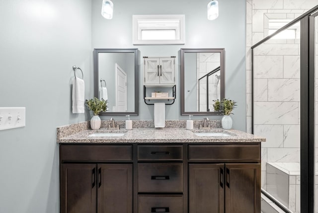 bathroom with vanity and an enclosed shower