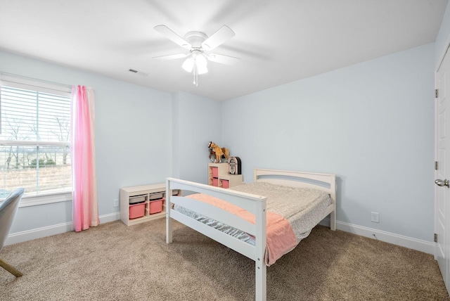 carpeted bedroom featuring ceiling fan