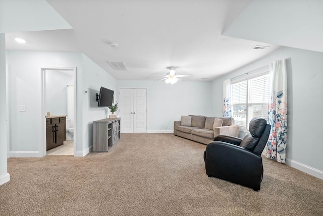 carpeted living room featuring ceiling fan