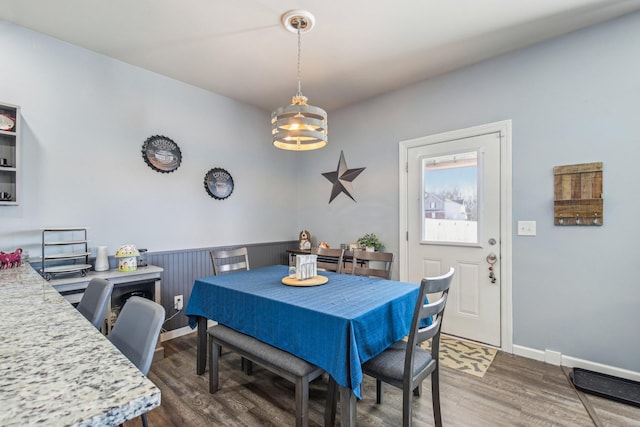 dining space with dark wood-type flooring